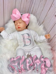 "100% COTTON This adorable customized outfit will have everyone in admiration of your little princess. This customized bodysuit is the perfect outfit for any occasion! Also offers an adorable large handmade ribbon bow with the perfect amount of sparkle and glam! The bodysuit is accented with matching handmade ribbon anklets (which are removable for easy cleaning and style changes, how awesome). The anklets offer the perfect fluffy look for your little one, which we receive endless compliments on Personalized Pink Onesie For Birthday, Personalized Pink Onesie For First Birthday, Customizable Cute Pink Onesie, Customizable Fitted Onesie, Personalized Fitted Pink Onesie, Customizable Fitted Pink Sets, Premie Clothes, Newborn Organization, Coming Home Outfit Baby Girl