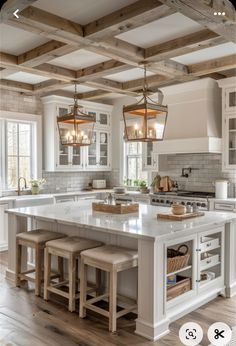 a large kitchen island with stools in the middle and an open floor plan on the other side