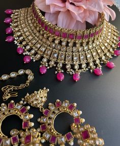 This choker is sure to be a complete statement look for your next event! made with gorgeous polki stones with antique gold finish and a pop of color with pink/purple beads, this choker is sure to be the perfect addition for your next occasion! comes with matching earrings and tikka! Polki Sets, Gold Bridal Necklace, Antique Finish, Bridal Necklace, Indian Bridal, Gold Finish, Matching Earrings, Antique Gold, Pink Purple