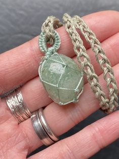 "Beautiful healing stone in gorgeous green tones. This is an extra fine specimen of aventurine in a large polished tumble. Green aventurine promotes humor, optimism, hope and joy. It helps keep its wearer well-grounded during times of change and emotional upheaval. I carefully knotted this netting with a strong hemp, entirely by hand, each tie done with love and intention, making sure everything was perfectly placed, so the stone is presented in its best light. Every knot, every twist is to ensu Handmade Green Crystal Spiritual Necklace, Handmade Nature-inspired Green Crystal Necklace, Green Wire Wrapped Crystal Necklace For Healing, Amulet Necklaces, Green Hand-strung Crystal Necklaces For Healing, Spiritual Healing Macrame Crystal Necklace, Stone Macrame, Done With Love, Tied Knot