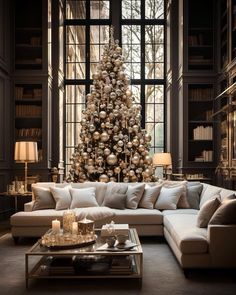 a living room filled with furniture and a christmas tree in the middle of the room