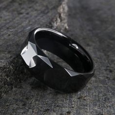 Expertly crafted 10mm Black Ceramic Men's Wedding Bands with a premium polish finish. Includes our deluxe comfort fit design. 8mm wide black ceramic ring Diamond texture Polish finish Polished inside Rounded profile Inside Comfort Fit Design Scratch Resistance Modern Black Diamond Cut Rings, Elegant Black Tungsten Carbide Rings, Modern Black Tungsten Carbide Jewelry, Formal Black Titanium Jewelry, Black Titanium Jewelry With Polished Finish, Modern Black Titanium Jewelry, Diamond Texture, Men's Wedding Bands, Polish Ceramics