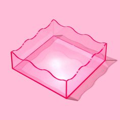 a pink plastic tray on a pink background