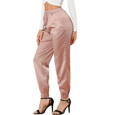 This stretch satin jogger take on a realxed silhouette for the new season, with sports tailoring with tassel drawcord gives it a new fashionable elevated twist. With Sneekers or heels to dress down or dress up. Occassion: Daily, Casual, Sports, Workout, Lounge. Perfect choice for any casual occassion at home or day out treaveling. Please check your measurements to make sure the item fits before ordering. Size: x small. Color: pink. Gender: female. Age Group: adult. Pattern: Solid. Material: Poly Planet Fashion, Loft Fashion, Athleisure Pants, Satin Joggers, Trendy Pants, Joggers Pants, Satin Pants, Stylish Pants, Stretch Satin