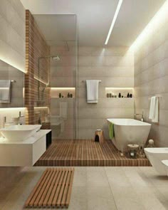 a bathroom with two sinks, a bathtub and a toilet