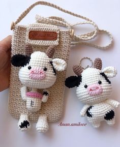 two small crocheted animals sitting next to each other