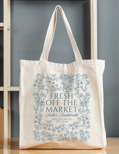 a tote bag with the words fresh off the market on it sitting on a table