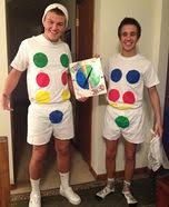 two people dressed up as clowns in the hallway