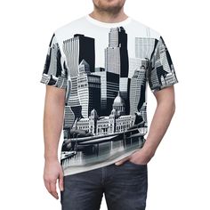 This American city-themed tee exudes a cool and urban vibe, perfect for casual outings and everyday wear. Ideal for city dwellers, travel enthusiasts, and anyone who loves American culture and landmarks. Great for Fourth of July celebrations, city events, and patriotic holidays. Product features - 100% Polyester fabric - Side seams for structural support - Ribbed knit collar for elasticity - Shoulder tape for stability - Regular fit Care instructions - Do not dryclean - Do not iron - Tumble dry: low heat - Do not bleach - Machine wash: cold (max 30C or 90F), gentle cycle Urban Tees, American City, Patriotic Shirt, Patriotic Holidays, American Culture, American Cities, Patriotic Shirts, Usa Travel, Graphic Shirts