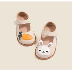 Introducing our Cartoon Rabbit Leather Flat Shoes – the perfect blend of comfort, style, and whimsical charm. Crafted with your little one's comfort in mind, these flat shoes are made from high-quality leather that's gentle on their delicate feet. The star of the show is our adorable cartoon rabbit or carrot design, adding a playful touch to your child's footwear collection. The strap ensures a secure fit, so your little explorer can hop and skip with ease while wearing these delightful shoes. W Casual Non-slip Leather Shoes With Round Toe, Casual Non-slip Round Toe Leather Shoes, Spring Cream Leather Shoes With Rubber Sole, Spring Ballet Flats With Rubber Sole And Round Toe, Spring Leather Shoes With Round Toe, Cream Leather Shoes With Flat Heel For Spring, White Leather Shoes For Spring, Cream Closed Toe Leather Shoes For Spring, Cute Mary Janes With Rubber Sole And Round Toe