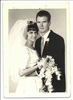 an old black and white photo of a bride and groom