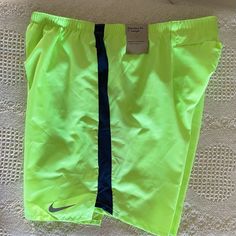 Neon Yellow/Green Nike 7” Running Shorts New With Tags Size Large Neon Yellow Sports Shorts For Summer, Nike Yellow Workout Shorts, Nike Green Athletic Shorts For Spring, Nike Green Athletic Shorts With Built-in Liner, Nike Yellow Sport Bottoms, Green Nike Shorts For The Beach, Nike Green Shorts For Spring, Sporty Neon Yellow Bottoms For Summer, Yellow Athletic Shorts With Built-in Shorts For Spring