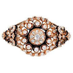 Victorian 14k rose gold bangle bracelet with black enamel inlays accented with 69 rose cut diamonds. Circa 1850-1860. 69 rose cut diamonds¸ approx. total weight 3.25cts Fits a standard 7 to 7 1/2 inch wrist 14k rose gold Tested: 14k 61.7 grams Inside dimensions: 2.16 x 2.02 inches Shape: Oval Width at top: 37.19mm Height at top: 21.84mm Width at Bottom: 7.97mm Rose Gold Bangle Bracelet, Rose Gold Bangle, Yellow Gold Bangle, Diamond Bangles Bracelet, Enamel Bangle, Hinged Bracelet, Gold Bangle Bracelet, Gold Bangle, Diamond Bangle