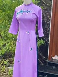 Elegant lavender ao dai set made with fine Tay Thi silk giving the ao dai set it soft smooth touch. Fine floral Embroidery . We match it with a teal color pant to match with the accent leaves of the flowers. Size run smaller then standard US size please refer to size chart. Long Sleeve Purple Kurta For Spring, Spring Wedding Purple Kurta, Spring Embroidered Blue Ao Dai, Spring Embroidered Purple Sets, Traditional Purple Sets For Spring, Traditional Lavender Fitted Dress, Fitted Purple Kurta For Spring, Spring Fitted Purple Kurta, Festive Lavender Long Sleeve Dress