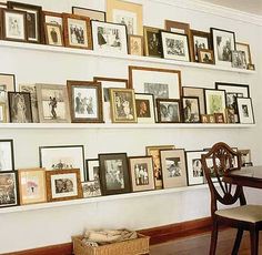 there are many pictures on the wall with frames