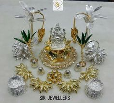 a collection of silver and gold items on a white surface with the words sri jewellers written below it