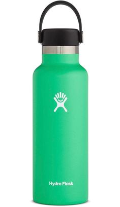 the hydro flask water bottle is green and has a black cap on it's lid