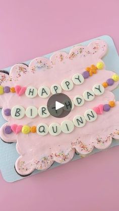 a birthday cake with the words happy birthday quinn on it and sprinkles