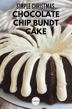 a chocolate bundt cake with white icing on a plate