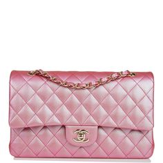 This Medium Classic Double Flap bag is in rose pink iridescent caviar leather with light gold tone hardware and features a front flap with signature CC turnlock closure, half moon back pocket, and adjustable interwoven light gold tone chain link and rose pink leather shoulder strap. The interior is lined in rose pink iridescent leather with the "love letter" zipper compartment under the first flap, an "outer" slit pocket is under the second flap, and an interior compartment with two open pockets Chanel Box, Pink Iridescent, Pink Chanel, Everything Pink, Pink Princess, Bijoux Diy, Hand Bags, Arm Candy, Coco Chanel