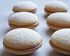 several pastries are sitting on a baking sheet