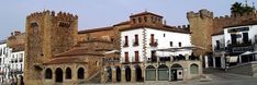 an old castle like building in the middle of town