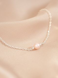 Pink freshwater pearl bracelet, silver cable chain and details. Elegant, great for daily use or for a special occasion.  Perfect as gift for a loved one or a lovely treat for yourself! Comes with a pink velvet pouch. 🌸This bracelet is: - Hypoallergenic - Handmade   - The size of the pearls is of approximately 5 mm. - Bracelet length can be of 14cm, 15 cm, 16cm, 17cm, 18 cm. Please choose your size from the options below. You can use our picture as reference on how to measure your wrist.   - Ext Feminine Pearl Bracelet For Gifting, Feminine Pearl Bracelets As Gift, Feminine Pearl Charm Bracelet As Gift, Feminine Pearl Bracelet For Gift, Feminine Pearl Bracelet Gift, Delicate Sterling Silver Pearl Bracelet As Gift, Gift Pearl Bracelet With Adjustable Chain, Pearl Bracelet With Adjustable Chain As Gift, Delicate Pearl Pendant Bracelet As Gift