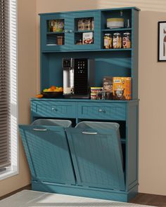 a blue cabinet with two bins on it and some food in the bottom shelf