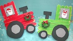 two handmade christmas decorations made out of popsicle sticks and construction paper with santa's sleigh on top