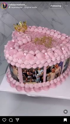 a large pink cake with pictures on it