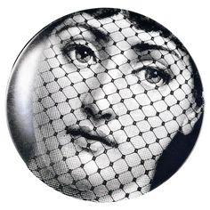 a black and white photo of a woman wearing a veil on her face with the words,