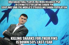 a man sitting in front of a blue background with sharks on it