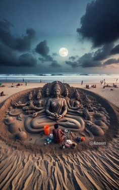 there is a sand buddha statue on the beach