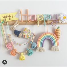 the word happy spelled out with toys and beads