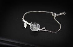 ♥ ♥ ♥ ♥ ♥ ♥ Click here to get coupon code. https://www.etsy.com/listing/256041708/10-off-discount-coupon-code-please-dont ♥ ♥ ♥ ♥ ♥ ♥ Our bracelets of Flower in the rain series. Dainty hand carved flower, made with natural white crystal. Decorated with silver stamens. Match with matt shiny silver real twig and chain mail style chain. Perfect tender gifts for women. Chain length: 16 cm/6.3 inch Attach chain: 3 cm/1.18 inch ♥ ♥ ♥ Offer brand new. Please check photos we provided for the details of Twig Bracelet, Bracelet Crystal, Sterling Bracelets, Bracelet Online, Flower Bracelet, Crystal Flower, Shiny Silver, In The Rain, Chain Link Bracelet