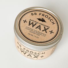 a tin of wax sitting on top of a white table