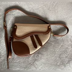 Brand New Saddle Bag Purse. Medium Sized. Perfect For Fall. Long Strap. Beige Saddle Bag With Adjustable Strap For Daily Use, Trendy Beige Saddle Bag With Detachable Strap, Retro Beige Shoulder Bag With Detachable Strap, Beige Satchel With Single Shoulder Strap For Errands, Beige Retro Shoulder Bag With Detachable Strap, Chic Beige Satchel With Single Handle, Trendy Beige Satchel For Day Out, Cream Satchel Shoulder Bag For Day Out, Beige Satchel With Adjustable Strap For Day Out