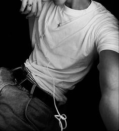 black and white photograph of a young man listening to music