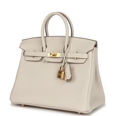 This Birkin is in Craie togo leather with gold hardware and has tonal stitching, two straps with front toggle closure, clochette with lock and two keys and double rolled handles.The interior is lined with Craie chevre and has one zip pocket with an Hermes engraved zipper pull and an open pocket on the opposite side.Collection: WOrigin: FranceCondition: New and never worn (plastic on hardware)Accompanied by: Hermes box, Hermes dustbag, clochette, lock, keys, clochette dustbag, felt, carebook, ribbonMeasurements: 10" width x 7.5" height x 4.75" depth; 2.75" handle drop Elegant Togo Leather Bags With Metal Hardware, White Luxury Bags With Brass Hardware, Luxury White Bags With Brass Hardware, Elegant Togo Leather Bag With Gold-tone Hardware, Hermes Birkin 25, Hermes Box, Togo Leather, Birkin 25, Hermes Birkin