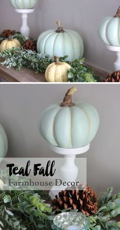 some white pumpkins sitting on top of a table with greenery and pine cones