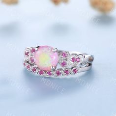 Pink Opal Ring, Opal and Ruby Wedding Ring Set, White Gold Opal Ring, Ruby Wedding Band, Pink Gemstone Ring, Vintage Bridal Promise Ring Unique wedding set,perfect as engagement/wedding ring, birthday or anniversary gift, etc. Engagement Ring ❀gemstone is 7mm round cut lab-created pink fire opal❀ ❀band stone is lab created ruby❀ ❀925 Sterling Silver,Rose/White/Yellow Gold Plated❀ ❀14/18k Solid White/Rose/Yellow gold❀ Wedding Band ❀Lab created ruby❀ ❀925 Sterling Silver,Rose/White/Yellow Gold Pla Pink Multi-stone Diamond Ring, White Cubic Zirconia Couple Rings For Wedding, Wedding Bridal Sets With Halo Setting, Pink Fine Jewelry For Wedding, Pink Jewelry With Center Stone For Wedding, Pink Diamond Birthstone Ring For Wedding, Halo Setting Birthstone Ring For Wedding, Pink Center Stone Jewelry For Wedding, Birthstone Ring With Halo Setting For Wedding