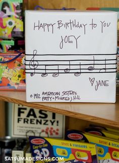 a birthday card is on top of a shelf in a children's book store