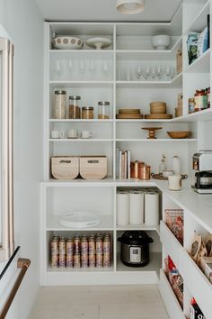 an organized pantry with lots of items on the shelves