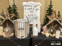 there are two tables set up with christmas decorations and gifts for sale at the store