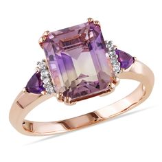 This attractive cocktail ring features an large octagon-cut ametrine center, two trilliant-cut amethyst side stones and eight round white diamonds. This beautiful ring is crafted of fine rose plated silver with a high polish finish. Purple Diamond Ring, Purple Amethyst Ring, Amethyst And Diamond Ring, Purple Diamond, Diamond Fashion Rings, Vintage Style Rings, Purple Jewelry, Vintage Diamond Rings, Diamond Cocktail Rings