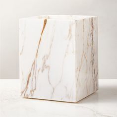 Rectangular wastebasket is crafted of Calacatta gold marble with rich natural veining and a smooth finish. Pair with the full Ramsey Calacatta gold marble bath collection for a coordinated look. CB2 exclusive.     Solid Calacatta gold marble  Variation in veining and activity of marble is to be expected; each will be unique  Wipe with a soft cloth  Imported Ramsey Calacatta Gold Marble Wastebasket Trash Can Bathroom, Calacatta Gold Marble, Marble Bath, Bath Collection, Calacatta Gold, Soap Pump, Black Tree, Popular Products, Waste Basket