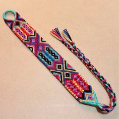 a pair of colorful bracelets on a table