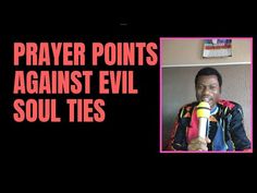 a man holding a microphone with the words prayer points against evil soul ties