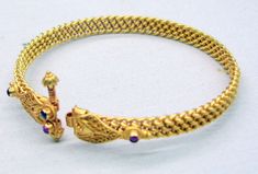 "Vintage 22 k gold bracelet bangle from rajasthan india. beautiful detailed design ,flexible piece and sated ruby color stones, secure screw closing (screw do not come full out, it is locked in end).full handcrafted great piece for your jewelry collection. buyer will get gold test report for this item for free. total weight -27 grams(0.94 ounce), inner diameter- 6.1 cm(2.37\") available same in different sizes too, width-0.8 cm, material -solid 22 karat gold." 22k Gold Temple Jewelry Bracelet With Intricate Design, Temple Jewelry Gold Bangle With Intricate Design, 22k Gold Temple Jewelry Bracelet For Ceremonial Occasions, 22k Gold Ceremonial Temple Jewelry Bracelet, Yellow Gold Temple Bangle With 17 Jewels, Traditional Ceremonial Gold Jubilee Bracelet, Gold Bracelet Bangle, 22k Gold Bangles, Ruby Color