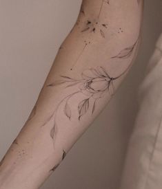 a person with a flower tattoo on their arm